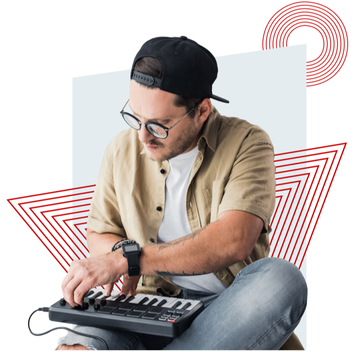 A man in a cap and sunglasses plays a small keyboard, with red geometric designs in the background.